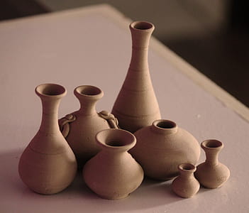 brown clay vases on table thumbnail
