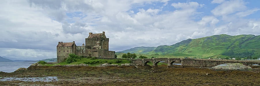 photo of concrete castle near body of water thumbnail