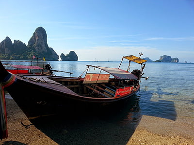 black canoe on beach thumbnail