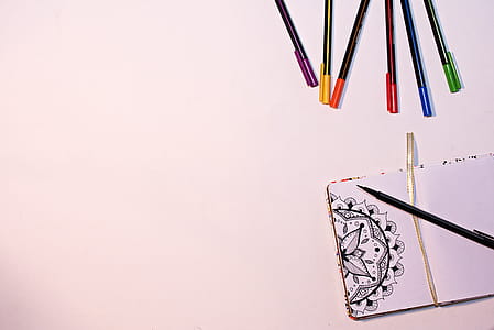 Color Markers on White Surface Near Book thumbnail