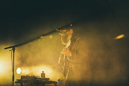 man playing guitar on stage thumbnail