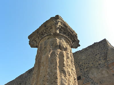 brown concrete pillar under sunny sky thumbnail