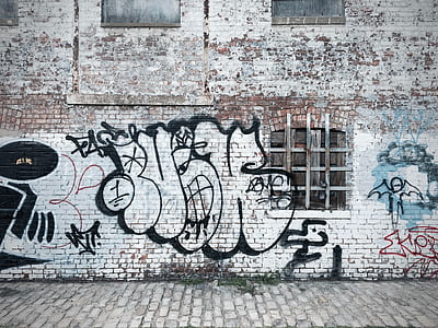 white brick building with vandal thumbnail