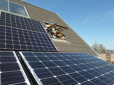 boy wearing black shirt near solar panel thumbnail