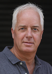 man wearing gray collared top thumbnail