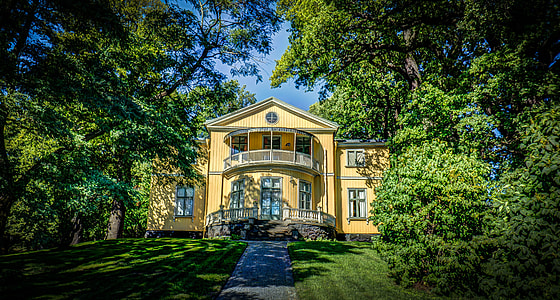 brown house between green trees thumbnail