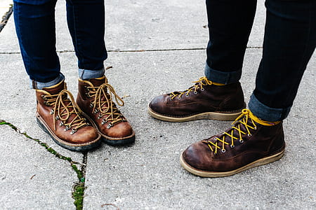 two person wearing brown leather lace-up boots thumbnail