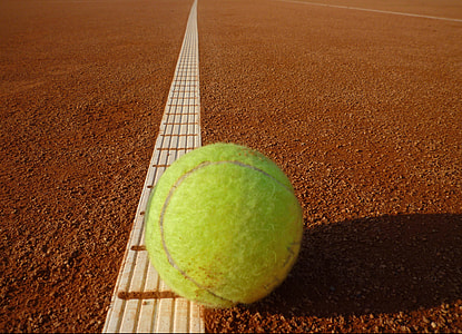 tennis ball on clay field thumbnail