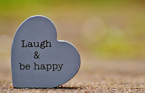 Laugh & be happy text on heart-shaped gray concrete decor thumbnail