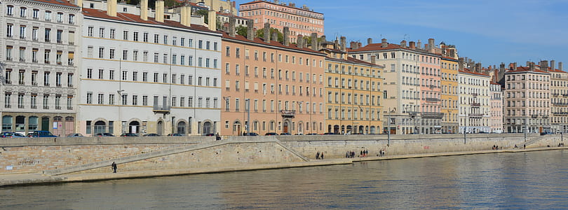 birds eye view of buildings beside body of water thumbnail