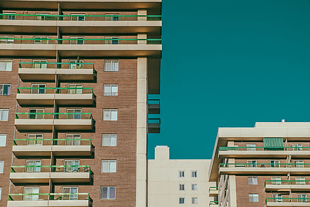 photography of brown concrete buildings during daytime thumbnail