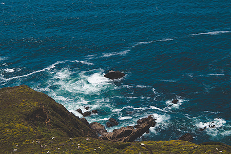 aerial photography of cliff and body of water thumbnail