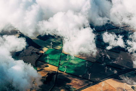 bird's-eye view photo of windmill generators on farm fields thumbnail