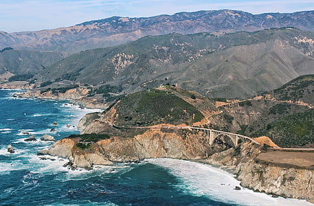 photo of mountains near ocean thumbnail