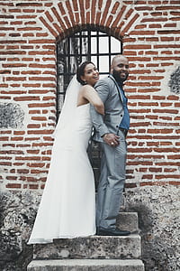groom and bride on concrete staircase thumbnail