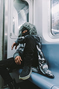 man wearing jacket on train sleeping thumbnail