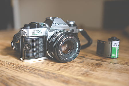 black and gray Canon DSLR camera thumbnail