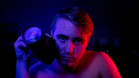 Photo of Man Holding a Camera thumbnail