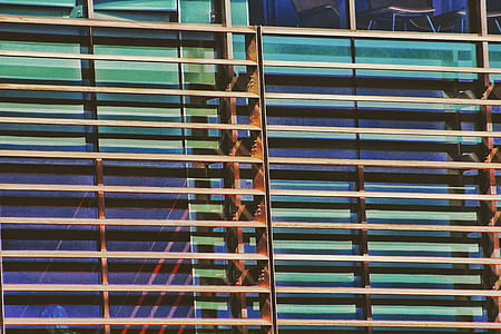 architectural photography of green and brown high-rise building thumbnail