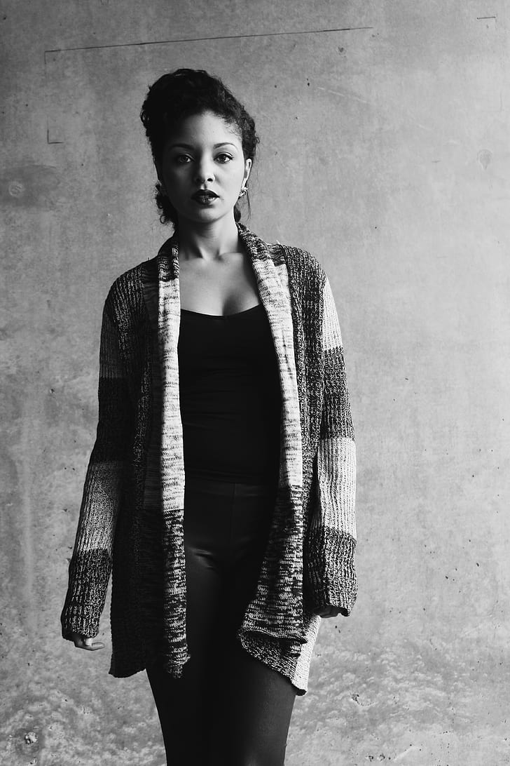 woman standing near the door in shallow photography