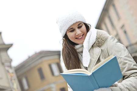 Woman in Gray Coat and White Cap thumbnail
