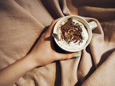 Person Holding Cup With Coffee Latte With Spoon Inside thumbnail