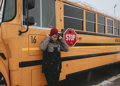 person standing beside of the bus thumbnail
