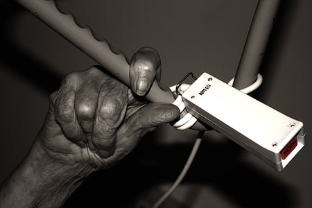 selective color photography of person holding onto bar thumbnail