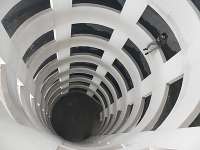man sitting on the edge of building thumbnail