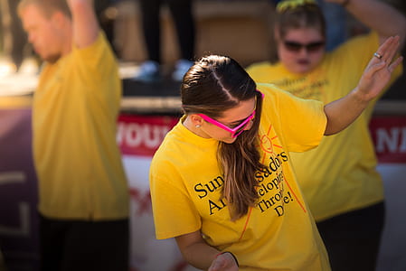 woman wearing pink sunglasses dancing thumbnail