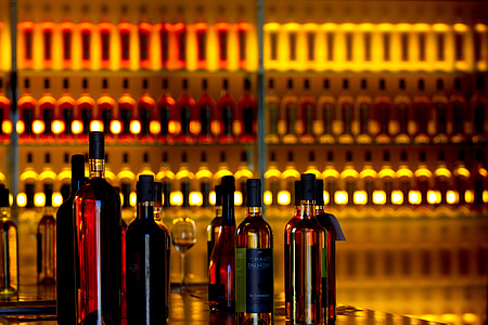 liquor bottles near bottles on rack thumbnail