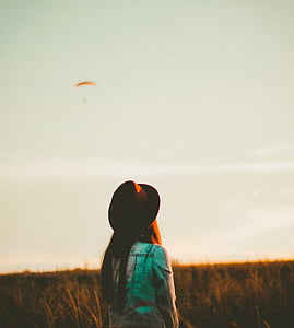 woman facing backwards outdoors thumbnail