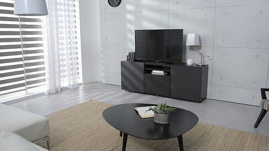photo of turned off flat screen television with black TV stand near window thumbnail