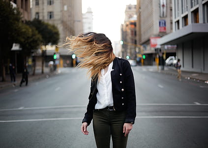 woman standing in the middle of the street thumbnail