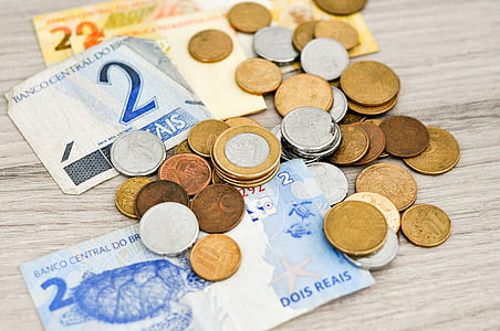 coins and banknotes on top of table thumbnail