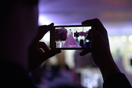 person taking a photo of the bride thumbnail