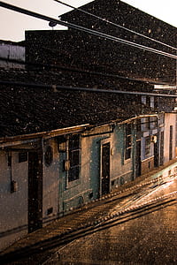 silhouette photography of building during raining thumbnail