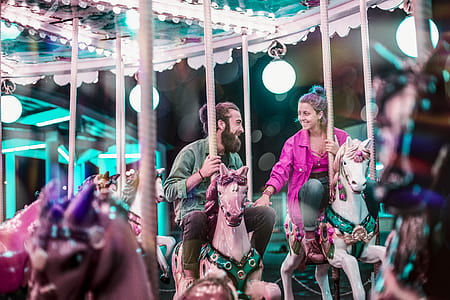 couple riding on horse carousel thumbnail