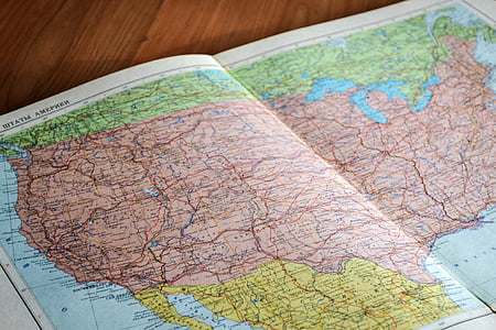 world map on brown plank thumbnail