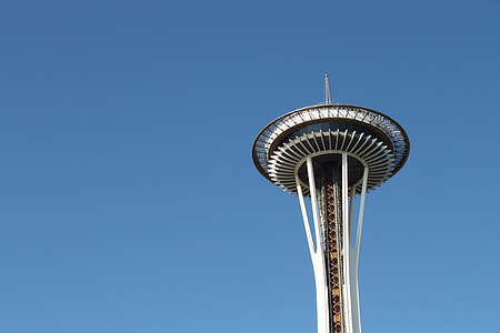 white and black high tower under blue sky at daytime thumbnail