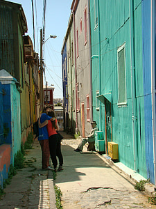 man and woman kissing on street during day time thumbnail