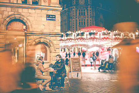 man and woman sitting on two chairs thumbnail