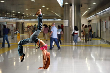 woman doing acrobat inside building thumbnail