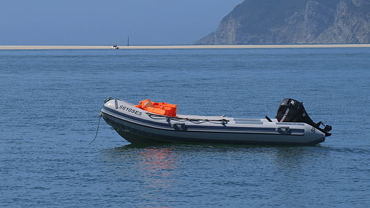 gray inflatable boat at the sea thumbnail