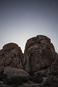 brown rock formation with shooting stars thumbnail