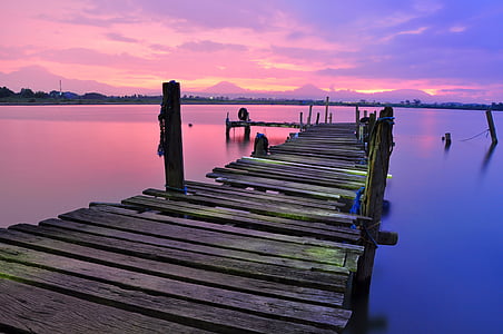 brown wooden dock during sunsety thumbnail
