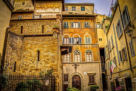 brown concrete house during daytime thumbnail