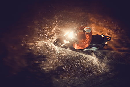 man riding motorcycle during nighttime thumbnail