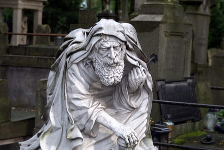 man holding cane statue thumbnail