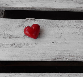 heart shape ornament on brown wooden surface thumbnail